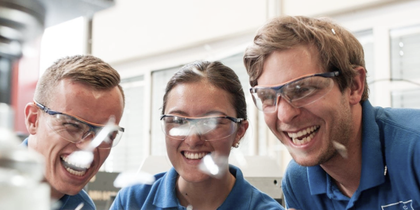 3 trainees with safety goggles 3 trainees with safety goggles